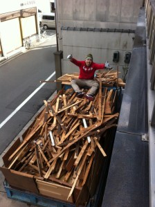 Yusuke-san on a pile of debris ready to be sent to the recycle center.